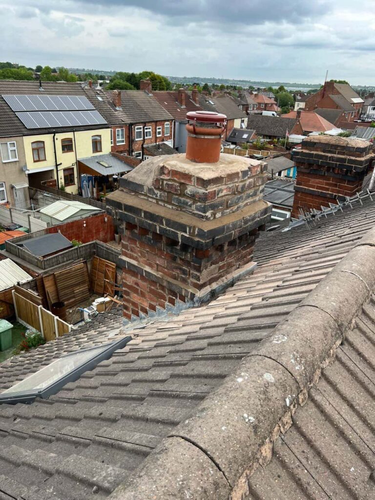 This is a photo taken from a roof which is being repaired by Cottenham Roofing Repairs, it shows a street of houses, and their roofs