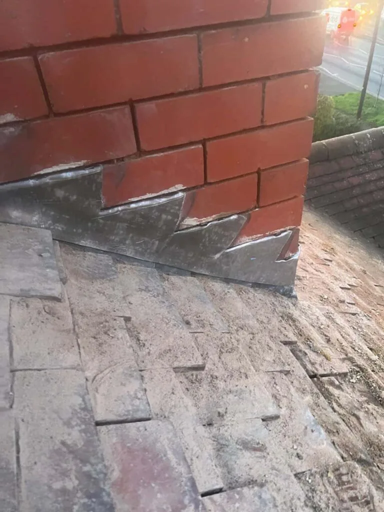 This is a photo of new leadwork being installed around an old chimney. Works carried out by Cottenham Roofing Repairs